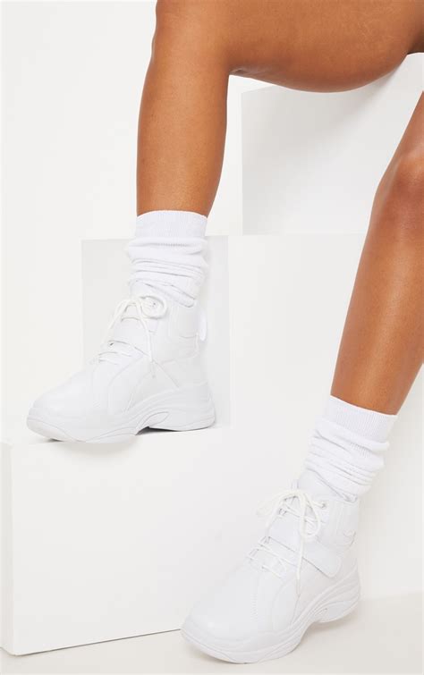 white chunky high top sneakers.